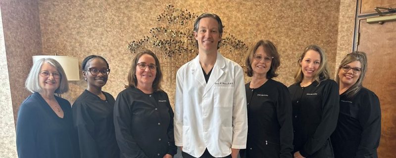 Group photo of the staff and the dentist