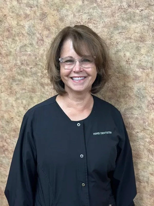 Image of smiling woman with brown hair